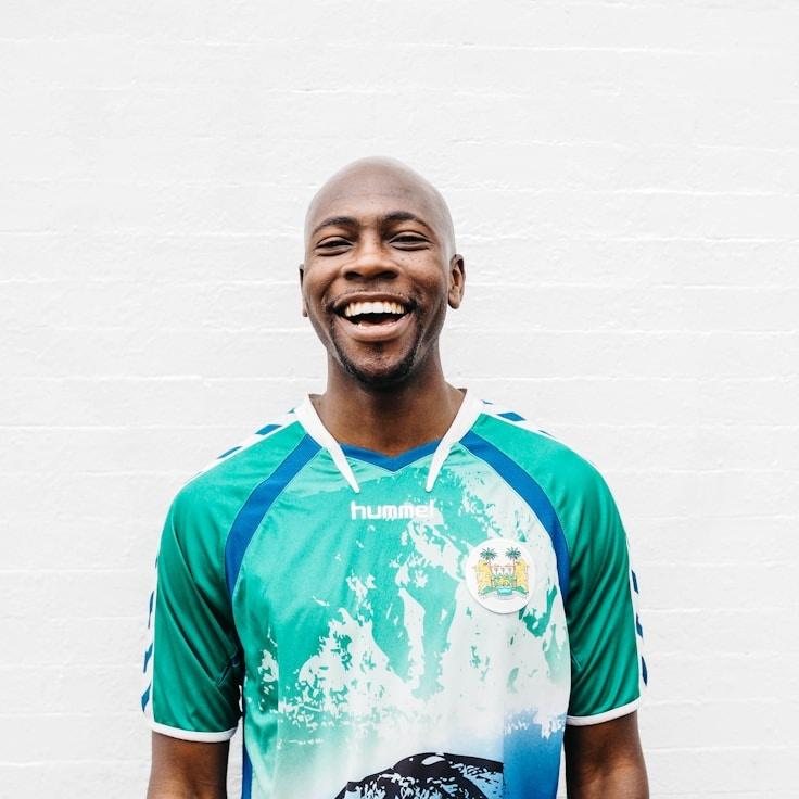 Kira M., Lead Design Curator at Sails Hore Ember, reviewing corporate floral arrangements